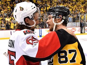 Erik Karlsson congratulates Sidney Crosby (87) after the Penguins defeated the Senators in double-overtime of the NHL's Eastern Conference final on May 25.