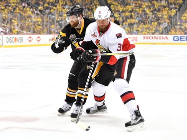 Marc Methot #3 of the Ottawa Senators collides with Phil Kessel #81 of the Pittsburgh Penguins during the first period in Game Seven of the Eastern Conference Final during the 2017 NHL Stanley Cup Playoffs at PPG PAINTS Arena on May 25, 2017 in Pittsburgh, Pennsylvania.