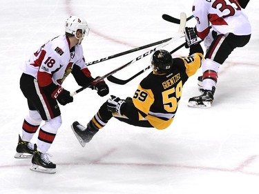 Ryan Dzingel #18 of the Ottawa Senators hits Jake Guentzel #59 of the Pittsburgh Penguins during the first period in Game Two of the Eastern Conference Final during the 2017 NHL Stanley Cup Playoffs at PPG PAINTS Arena on May 15, 2017 in Pittsburgh, Pennsylvania.