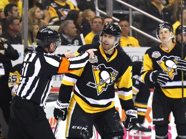 Matt Cullen #7 of the Pittsburgh Penguins argues a slashing call with referee Kelly Sutherland #11 against the Ottawa Senators during the first period in Game Two of the Eastern Conference Final during the 2017 NHL Stanley Cup Playoffs at PPG PAINTS Arena on May 15, 2017 in Pittsburgh, Pennsylvania.