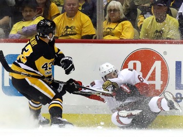 Conor Sheary #43 of the Pittsburgh Penguins trips Chris Wideman #6 of the Ottawa Senators during the first period in Game Two of the Eastern Conference Final during the 2017 NHL Stanley Cup Playoffs at PPG PAINTS Arena on May 15, 2017 in Pittsburgh, Pennsylvania.