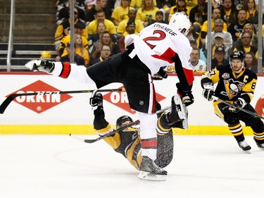 Dion Phaneuf #2 of the Ottawa Senators hits Bryan Rust #17 of the Pittsburgh Penguins during the first period in Game Two of the Eastern Conference Final during the 2017 NHL Stanley Cup Playoffs at PPG PAINTS Arena on May 15, 2017 in Pittsburgh, Pennsylvania.