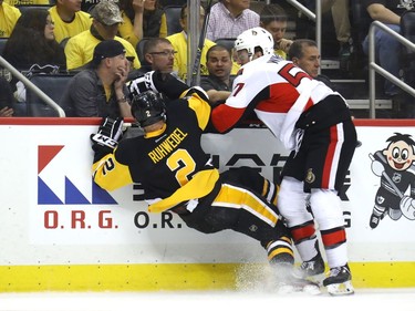 Tommy Wingels #57 of the Ottawa Senators checks Chad Ruhwedel #2 of the Pittsburgh Penguins during the first period in Game Two of the Eastern Conference Final during the 2017 NHL Stanley Cup Playoffs at PPG PAINTS Arena on May 15, 2017 in Pittsburgh, Pennsylvania.