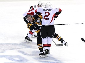 Dion Phaneuf #2 of the Ottawa Senators checks Jake Guentzel #59 of the Pittsburgh Penguins during the second period in Game Two of the Eastern Conference Final during the 2017 NHL Stanley Cup Playoffs at PPG PAINTS Arena on May 15, 2017 in Pittsburgh, Pennsylvania.