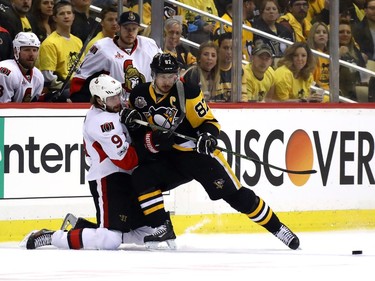 Sidney Crosby #87 of the Pittsburgh Penguins fights for the puck against Bobby Ryan #9 of the Ottawa Senators during the first period in Game Two of the Eastern Conference Final during the 2017 NHL Stanley Cup Playoffs at PPG PAINTS Arena on May 15, 2017 in Pittsburgh, Pennsylvania.