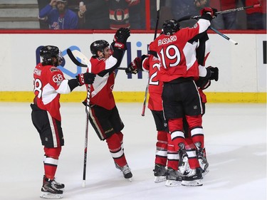 The Ottawa Senators celebrate after Derick Brassard's game-tying goal late in the third period of Game 5.