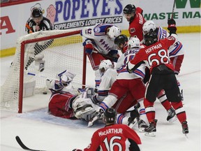 The Ottawa Senators' Derick Brassard gets the puck past the Rangers' Henrik Lundqvist and ties the game up 4-4 with 1:26 left in the third period.