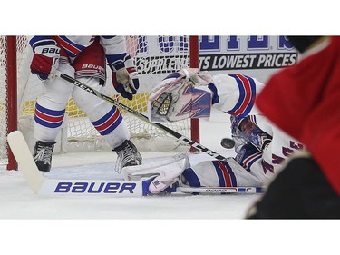 New York Rangers goalie Henrik Lundqvist stretches out in attempt to make the save.