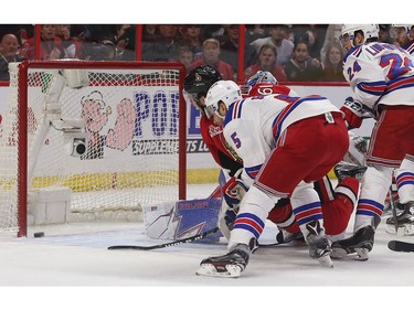 The Ottawa Senators' Mark Stone scores on New York Rangers goalie Henrik Lundqvist during the first period.