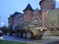 Passersby cheered as army vehicles enter the Hull Regiment on Saturday evening May 6, 2017, from CFB Valcartier near Quebec City. Dylan C. Robertson/Postmedia