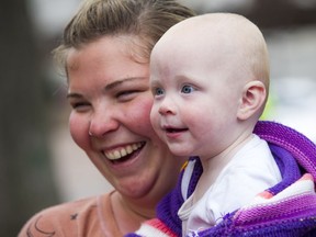 Junia Boos, 11 months old, and her mother, her mother Kandace Boos were among those who trekked to Ottawa from Kitchener-Waterloo.