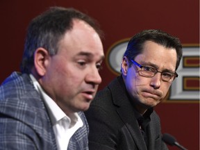 Ottawa Senators coach Guy Boucher looks on as general manager Pierre Dorion answers questions from media at a wrap up press conference in Ottawa on Monday, May 29, 2017.