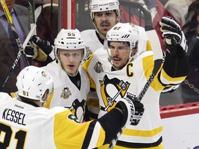 Pittsburgh Penguins captain Sidney Crosby celebrates with teammates after scoring in Game 4. Crosby had two goals and an assist in games 3 and 4 at the Canadian Tire Centre in Ottawa.