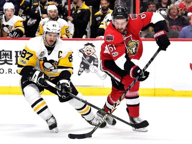 Sidney Crosby #87 of the Pittsburgh Penguins fights for the puck against Mark Stone #61 of the Ottawa Senators during the first period in Game Six of the Eastern Conference Final during the 2017 NHL Stanley Cup Playoffs at Canadian Tire Centre on May 23, 2017 in Ottawa, Canada.