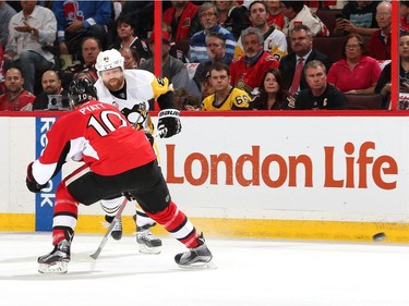 Phil Kessel #81 of the Pittsburgh Penguins takes a shot against Tom Pyatt #10 of the Ottawa Senators during the first period in Game Six of the Eastern Conference Final during the 2017 NHL Stanley Cup Playoffs at Canadian Tire Centre on May 23, 2017 in Ottawa, Canada.