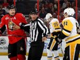 Dion Phaneuf #2 of the Ottawa Senators with Phil Kessel #81 of the Pittsburgh Penguins during the second period in Game Three