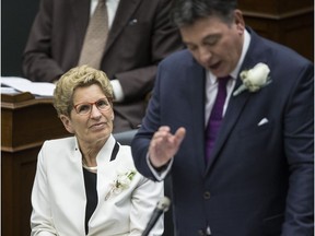 Premier Wynne and Charles Sousa reading of the budget at Queens Park on Thursday April 27, 2017.