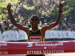 Yemane Tsegay crosses the finish line in Ottawa in record time back in 2014.