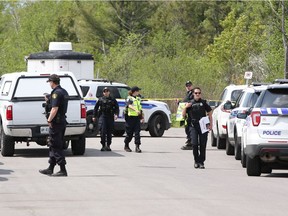 Police are seen at the end of Main Street in Stittsville, near where the body of 82-year-old Nelliya Karbisheva was found on Thursday, May 25, 2017. Karbisheva, who had a form of dementia, had gone missing on Sunday.