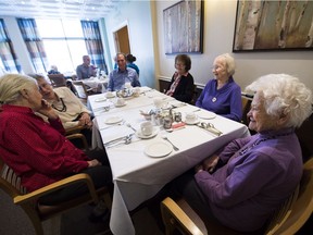 Inge Kristensen, 86 (left to right), Ada Garrison, 80, Robert Innis, 76, Mary Viglasky, 90, Eda Slak, 85; and Dorothy Buck, 93, get ready for lunch in the dining room at the New Horizon old age home in Toronto on Tuesday, May 2, 2017. As Canada ages, elderly women are confronting the challenges of going it alone.