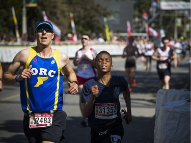 Runners finish the 5k race with a full head of steam.