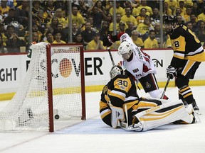 Ottawa Senators center Ryan Dzingel (18) scores a goal against Pittsburgh Penguins goalie Matt Murray (30) during the third period of Game 7 in the NHL hockey Stanley Cup Eastern Conference finals, Thursday, May 25, 2017, in Pittsburgh.