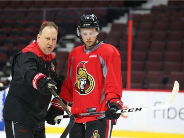 Ryan Dzingel (R) and assistant coach, Martin Raymond, of the Ottawa Senators chat during morning practice at Canadian Tire Centre in Ottawa, May 12, 2017.
