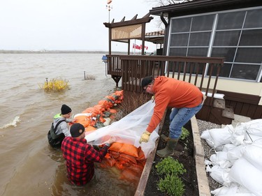 Sand bags are brought to help stop the Ottawa river from flooding cottages on Wilson rd in Rockland, May 08, 2017.