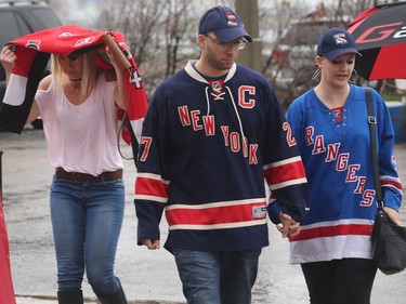 Ottawa Senators and New York Rangers fans arrive in the rain at the Canadian Tire Centre on Saturday, May 6, 2017.