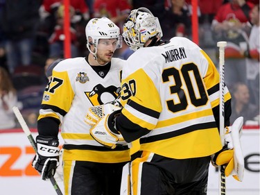 Sidney Crosby congratulates Matthew Murray on the win after Game 4.