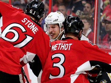 Sidney Crosby is surrounded by Mark Stone and Marc Methot in the second period as the Ottawa Senators take on the Pittsburgh Penguins in Game 3 of the NHL Eastern Conference Finals at the Canadian Tire Centre.  Wayne Cuddington/Postmedia