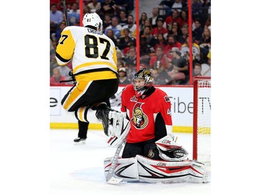 Sidney Crosby jumps out of the way of a shot on Craig Anderson in the second period as the Ottawa Senators take on the Pittsburgh Penguins in Game 3 of the NHL Eastern Conference Finals at the Canadian Tire Centre.  Wayne Cuddington/Postmedia