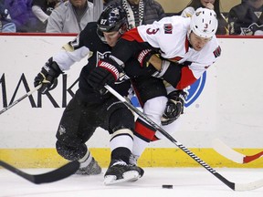 Pittsburgh Penguins' Sidney Crosby (87) collides with Ottawa Senators' Marc Methot (3) during the second period of an NHL hockey game in Pittsburgh, Saturday, Dec. 6, 2014. Methot is focused on helping the Senators beat the Penguins in the Eastern Conference Final, but knows much will be made of a Sidney Crosby slash that left the Senators defenceman with a lacerated finger.