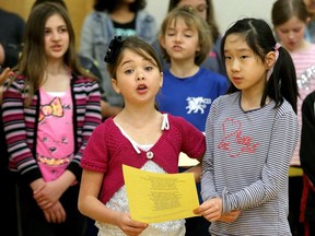- Singers Avery Glaude and Chloe Wei, both in grade four,  sing their parts. Mentors from Listen Up - a program started by the Gryphon Trio to engage kids in music and the spoken word - were working with students at Adrienne Clarkson Elementary School Monday (May 15, 2017) in preparation for their big concert on Wednesday.