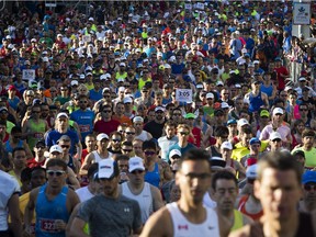 Some of the elite runners lead the start of the full marathon Sunday morning, part of the Tamarack Ottawa Race Weekend.