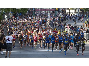 Some of the elite runners lead the start of the full marathon Sunday morning, part of the Tamarack Ottawa Race Weekend.