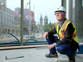 The man behind the rejuvenation, architect Donald Schmitt, checks on the progress of The Lantern - the glass tower centrepiece of the renovation.