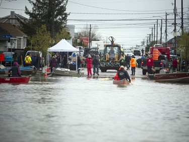 The military have arrived to help people who have been affected but the heavy flooding in the Gatineau area Sunday May 7, 2017. Volunteers are also on hand helping with sandbags and escorting people into their homes in boats.