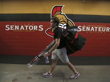 The Ottawa Senators' Chris Wideman leaves the dressing room after clearing out his locker.