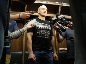 The Ottawa Senators' Mark Borowiecki speaks to reporters as the Sens clean out their lockers at the Canadian Tire Centre.