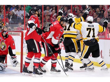 The Penguins celebrate after Sidney Crosby scored on Craig Anderson.