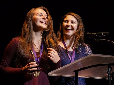 The winners for Ensemble in a Musical: The Stepsisters portrayed by Emily Grace Linton-LeBlanc (L) and Julia Millan (R), Lester B. Pearson Catholic High School, Rodgers & Hammerstein's Cinderella, accept their award, during the annual Cappies Gala awards, held at the National Arts Centre, on May 28, 2017, in Ottawa, Ont