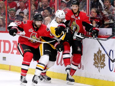 The Senators' Tom Pyatt, left, and Kyle Turris battle with Chad Ruhwedel in Game 4 at the Canadian Tire Centre on Friday, May 19, 2017.