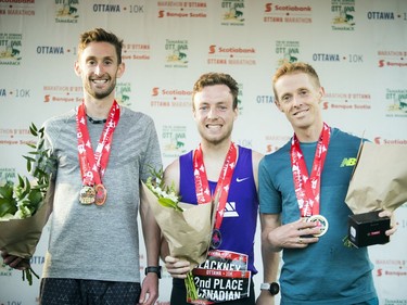 The top Canadian male runners in the 10K race were, from left, Kevin Coffey (third place), Kevin Blackney (second place) and Eric Gillis (first place).