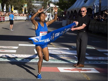 Top female finisher of the 10K race Netsanet Gudeta at the finish line.