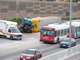 Traffic is snarled on the westbound Queensway between the Vanier Parkway and Nicholas St exit as crews wait to clear a damaged tractor trailer that was leaking fuel following an accident.