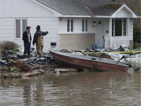 A wall of sandbags surrounds a house in the flooded area of Gatineau.