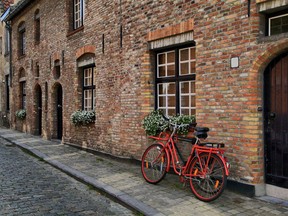 Varied brick colours and arches are two traditional design elements that make this brick building look great.