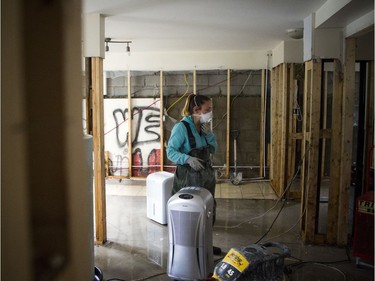 Myriam Talbot works at a Gatineau rental property she owns with Jean-François Hébert. They were told they will have no funding for the rebuild.