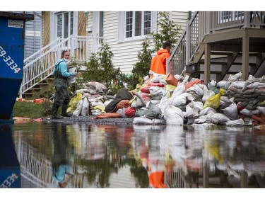 Water levels in Gatineau have started to come down in the flooding but major damage is starting to show Saturday May 13, 2017. Myriam Talbot works at a Gatineau rental property she owns with Jean-Francois Hebert. They were told they will have no funding for the rebuild.